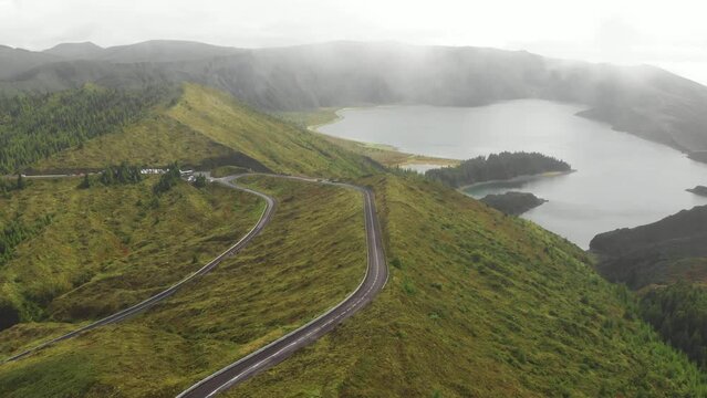 Epic fogy video of lakes, landscape of the island of San Miguel. Aerial view of the Azores. Lakes in Sete Cidades volcanic craters on San Miguel island, Azores, Portugal. Drone footage 4K.