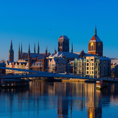 Naklejka premium 2022-12-09 First snow in winter the historical part of the city of Gdansk Poland