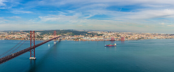 The 25 de April Bridge in Lisbon Portugal. Panoramic view