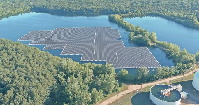Clean alternative renewable energy with floating solar panels cell platform system to generate clean electricity farm in lake