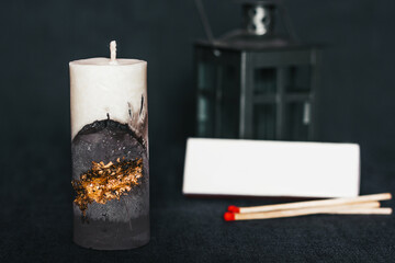 An incredibly beautiful candle on a clean background. Handmade wax and concrete candle with...