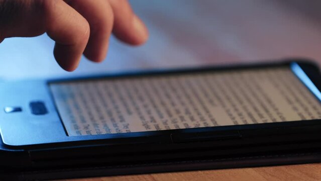 A man reading an electronic book