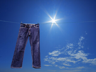 blue jeans on the clothesline in sunny day