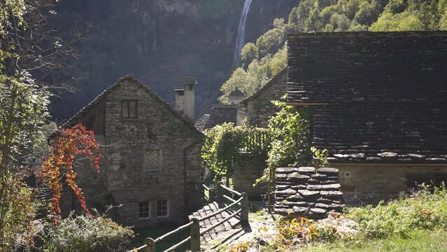 Aerial of Bellinzona Switzlerland waterfall behind village buildings