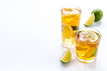 Alcoholic cocktails with oganges and ice in glasses. Alcoholic drinks background