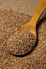 Buckwheat on a background of burlap. Tasty and healthy food