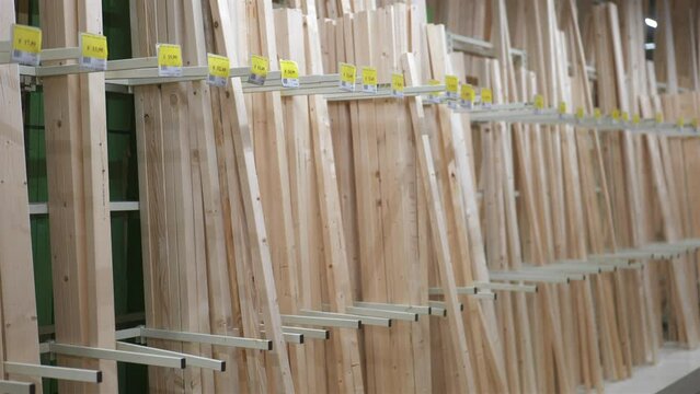 Shot of planks of timber in carpentry store warehouse