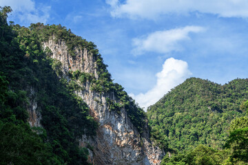 Hill landscape with blue sky and clouds
