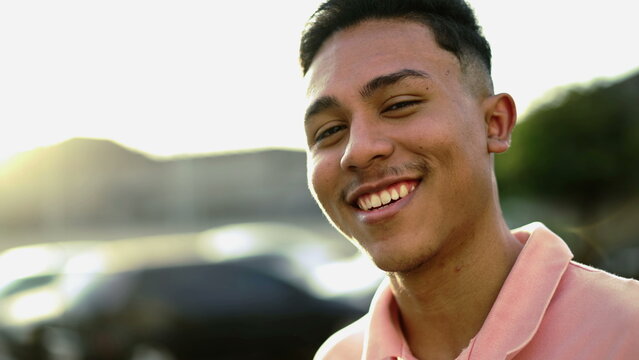 Young Hispanic Man Portrait Face Smiling At Camera Standing Outdoors. Happy South American Brazilian Person