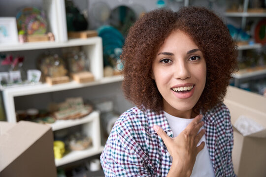 Happy woman enjoying her job in own decoration store