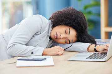 Black woman, sleeping and office desk while tired, burnout and fatigue while asleep by laptop at corporate company, head on table to relax. Lazy entrepreneur exhausted and sleepy due to work stress
