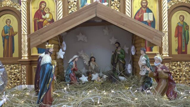 a beautiful Christmas nativity scene,decorated Christmas nativity scene on the hay, Christmas figurines in the nativity scene