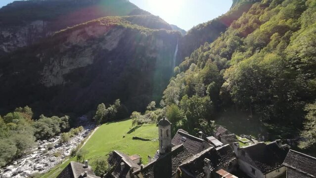 Aerial of Bellinzona Switzlerland waterfall behind old buildings