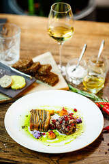 Shiitake and potatoes. Vegan. Shiitake mushroom, potato gratin, Beluga lentils, yellow beet cream. Delicious healthy traditional food closeup served for lunch in modern gourmet cuisine restaurant