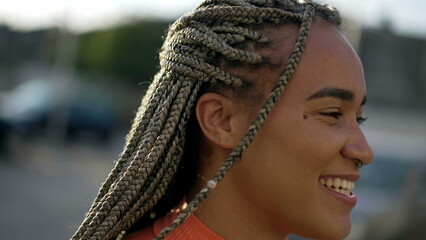 Portrait of a black hispanic latin young woman smiling at camera. Brazilian latin adult girl closeup face