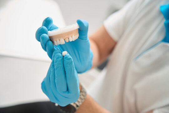 Orthodontist preparing to carry out dental procedure