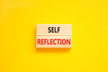 Self reflection symbol. Concept word Self reflection typed on wooden blocks. Beautiful yellow table yellow background. Business psychological and self reflection concept. Copy space.