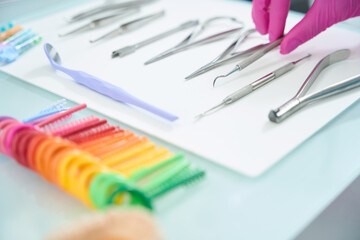Working set of the orthodontist doctor lies on surgical table