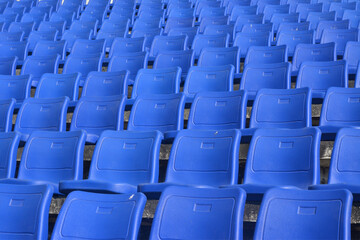 blue chair on stadium.  To watch a sporting event.