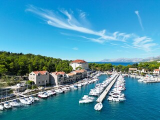 Fototapeta na wymiar Boats moored Makarska harbour Croatia Dalmatian coast drone aerial view ..