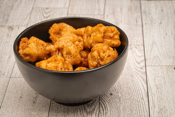 Deep fried Lion's mane mushroom bites in a black bowl