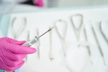 Specialist holds a medical instrument in his hand