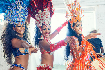 Carnival performance, women and mardi gras dancer portrait on new year dancing with a smile. Concert female group at a social celebration event with music and sexy show dance party and festival