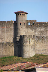 The old city walls of Carcassonne with the medieval towers of Porte Rouge and Charpenterie, Aude department in France
