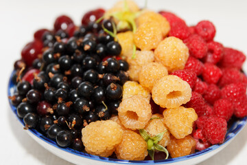 Berries plate, ripe fresh assorted, cherries, white and red raspberries and currants