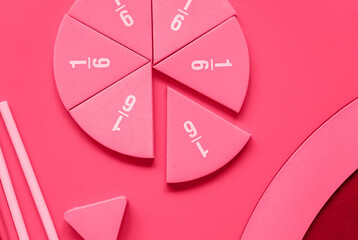 Fractions on magenta background. Back to school, fun education concept. close up. Viva magenta color of the 2023 year