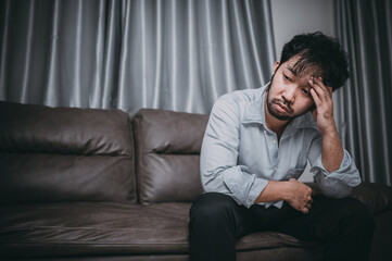 Asian handsome man stress from work overload,Tired male come back home after a lot of work from company,risk of depression