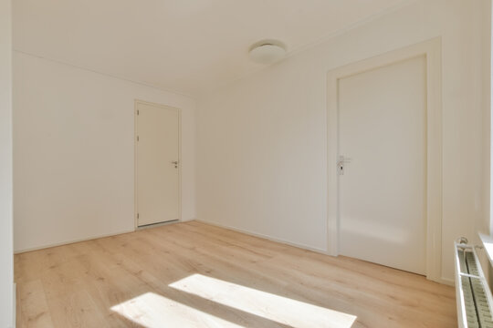 Empty room interior with doors and parquet