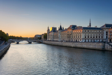 The Conciergerie palace and prison by the Seine river at dawn, Paris. France