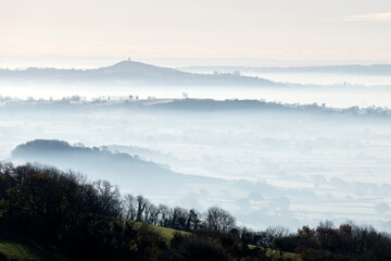 View through the clouds to Glastonbury Tor from Draycott Sleights © Alan