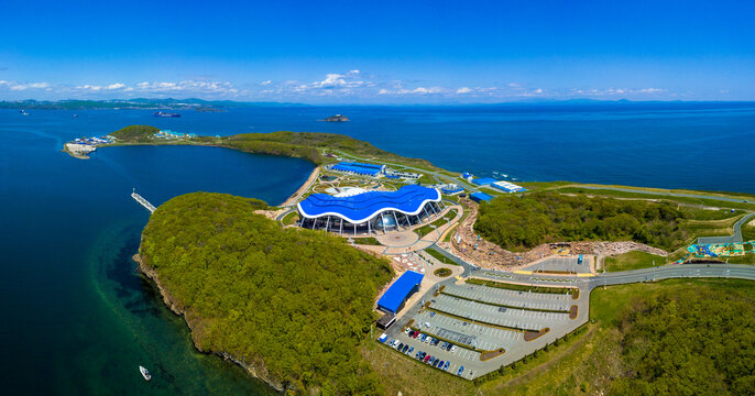 Summer, 2018 - Vladivostok, Russia - The building of the Primorsky Oceanarium on Russky Island. Modern aquarium in sunny weather. View from above.