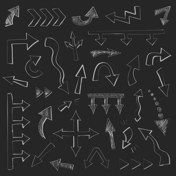 Big set of 32 chalk hand drawn arrows different shape. Big and small doodle arrow marks, cursors for infographic, planning,  mind maps. Pointer sketch on black board