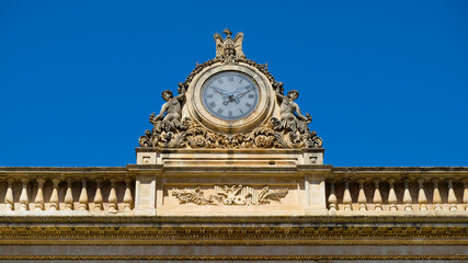 Modica, Sicily. Detail of the clock at the top of Garibaldi theatre facade.