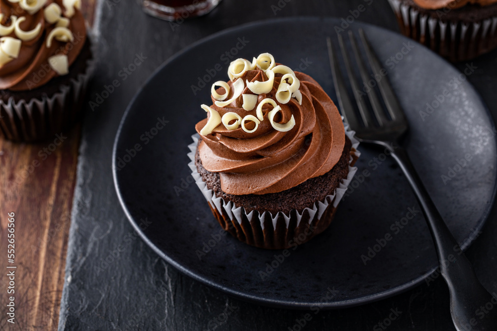 Wall mural Chocolate cupcakes with dark chocolate ganashe frosting