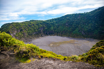 panorama of volcano iraz&uacute; in costa rica, volcanic landscape of Iraz&uacute; Volcano National Park, mighty volcano in clouds in costa rica mountains