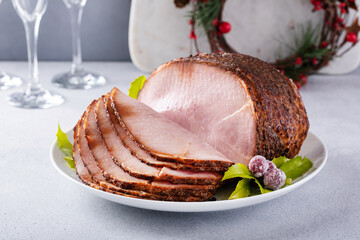 Christmas ham for celebration dinner, spiral sliced ham on a serving plate