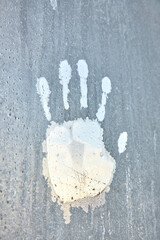 Handprint on frosty frost on the glass, frost, cold, temperature drop patterns on the window.