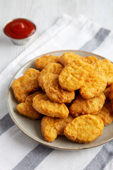 Homemade Chicken Nuggets with Ketchup, side view.