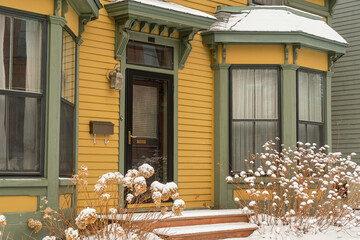 Traditional older home after a snowfall.