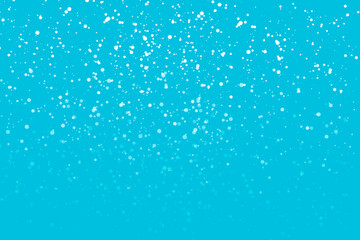 Snow falling on blue background