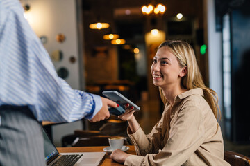 Writer works in a cafe and pays for her coffee contactless