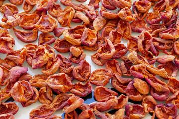drying apricots on the balcony in the home environment, close-up dried apricots,