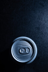 metal can with beer on a black background close-up