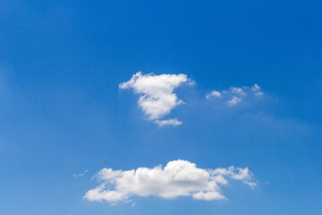 blue sky, with small clouds on a sunny summer day.