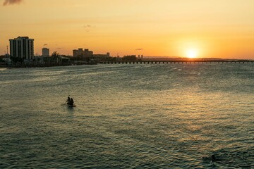 two people canoeing in the sea of Fortaleza north of Brazil