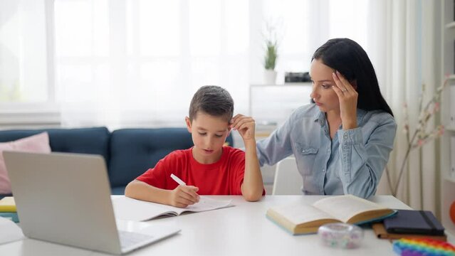 Mother and son having difficulty with school homework, challenging math problem